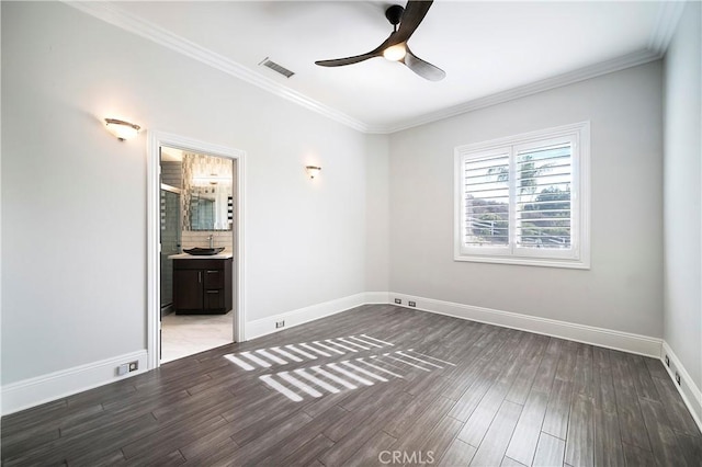 unfurnished bedroom featuring ceiling fan, dark wood-type flooring, connected bathroom, and ornamental molding