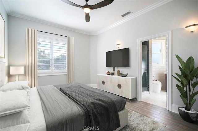 bedroom with ceiling fan, hardwood / wood-style floors, ensuite bathroom, and crown molding