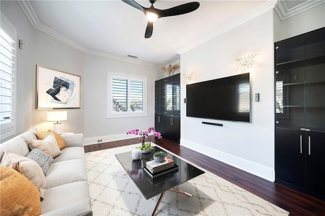 living room featuring ceiling fan, dark wood-type flooring, and ornamental molding