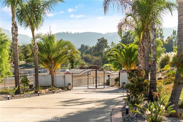 view of gate featuring a mountain view