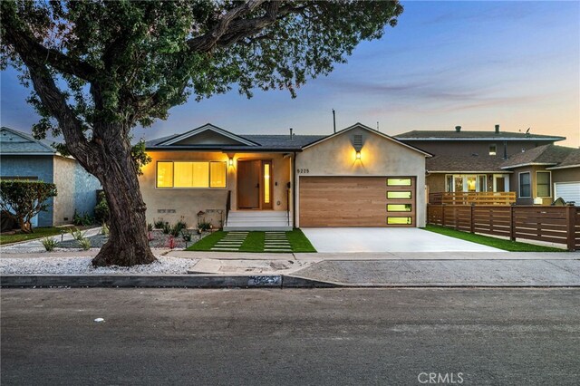 ranch-style home featuring a garage