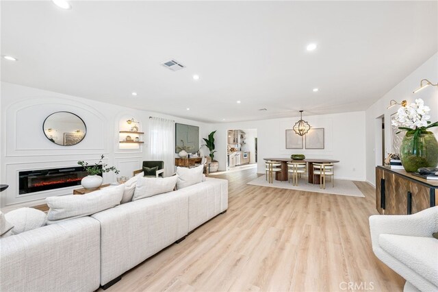 living room with light hardwood / wood-style flooring