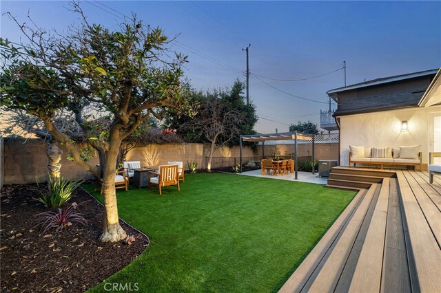 view of yard featuring a pergola, a patio area, and outdoor lounge area