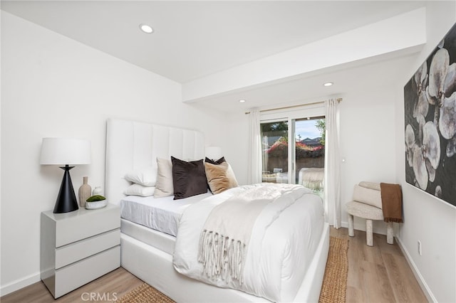 bedroom featuring access to outside and light wood-type flooring