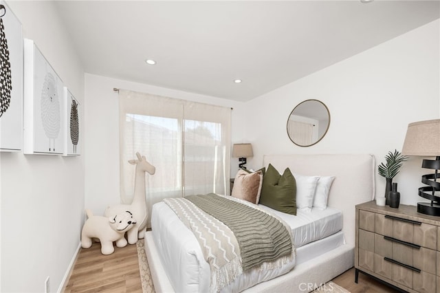 bedroom featuring light wood-type flooring