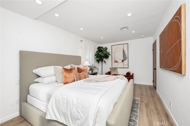 bedroom featuring light hardwood / wood-style flooring