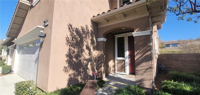 view of property exterior featuring a garage