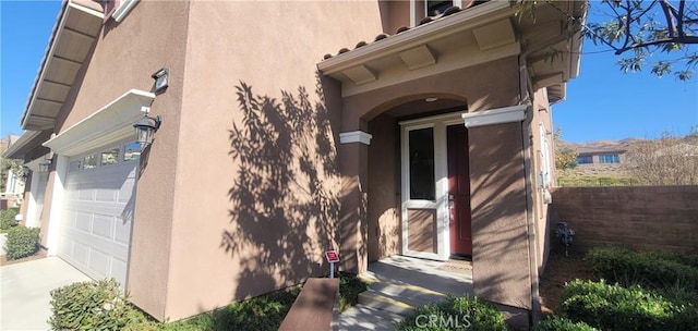 view of property exterior with a garage