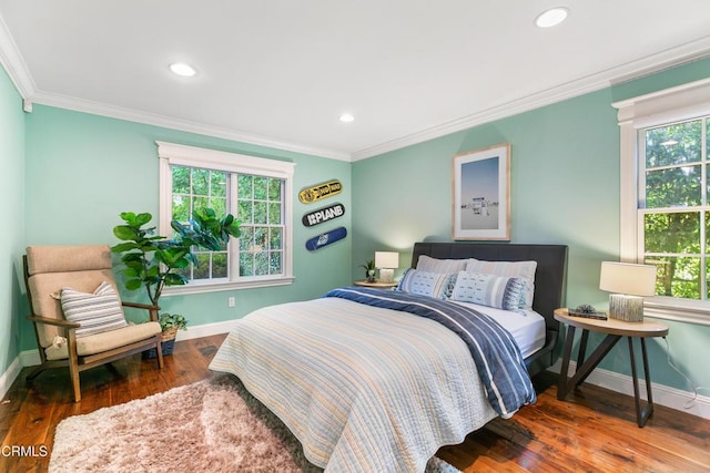 bedroom featuring wood-type flooring and crown molding