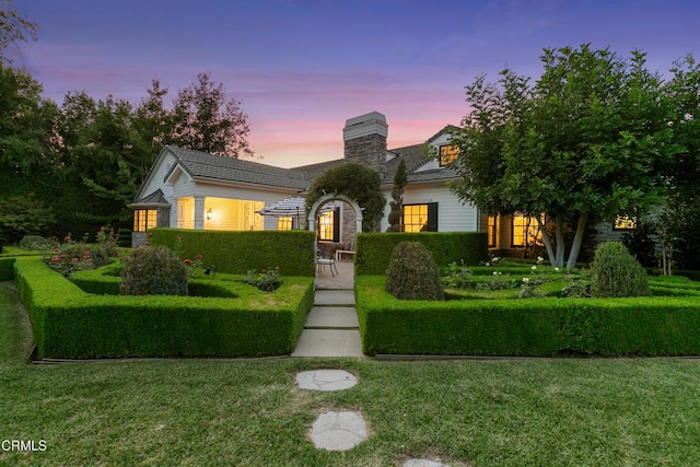 view of front of home with a yard