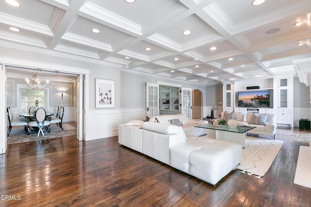 living room with crown molding, beam ceiling, and coffered ceiling