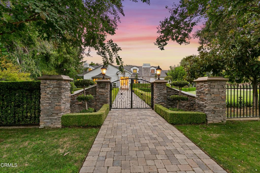 gate at dusk with a yard