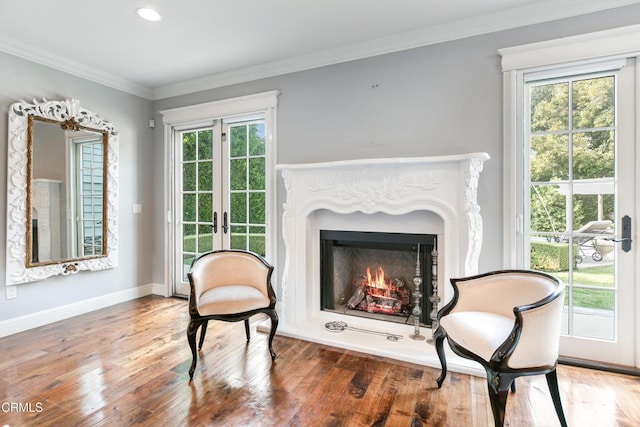 sitting room with french doors, dark hardwood / wood-style floors, and plenty of natural light