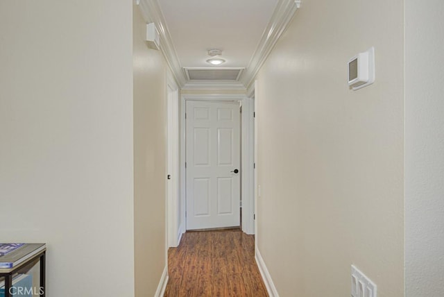 hall featuring dark wood-type flooring and crown molding