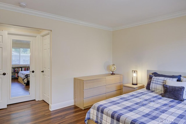 bedroom featuring dark wood-type flooring and crown molding