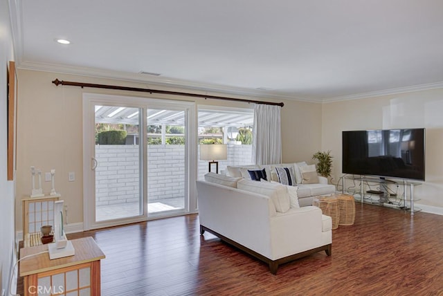 living room with dark wood-type flooring and crown molding