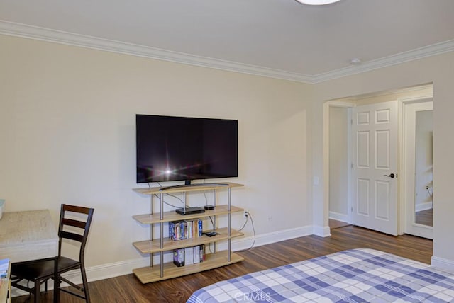 bedroom with dark hardwood / wood-style floors and ornamental molding