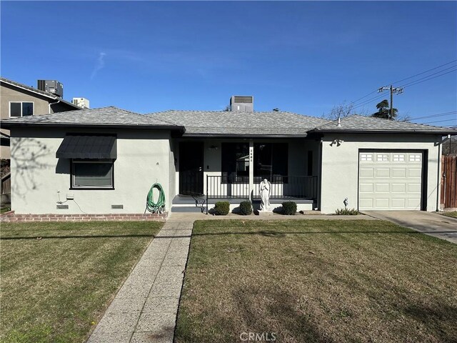 ranch-style house with a garage, a front yard, central AC unit, and covered porch