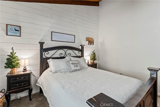 bedroom featuring vaulted ceiling and dark colored carpet