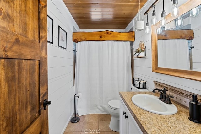 bathroom with wood ceiling, tile patterned flooring, vanity, toilet, and wood walls