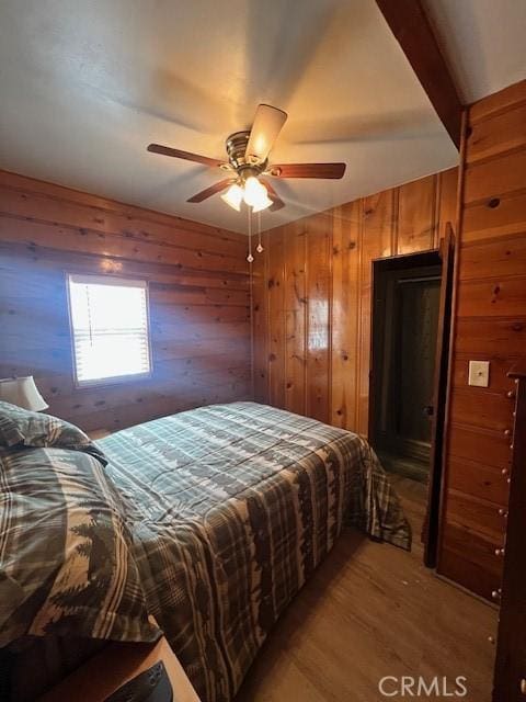 bedroom with ceiling fan and hardwood / wood-style floors