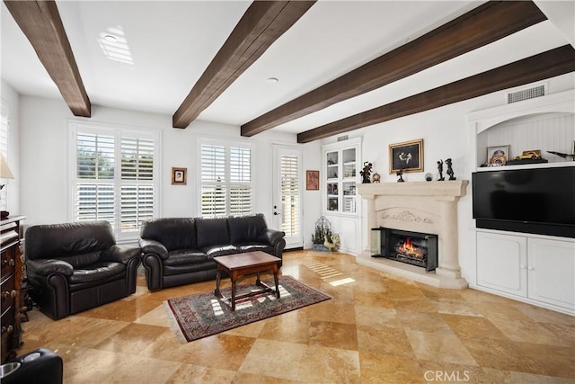 living room featuring beam ceiling