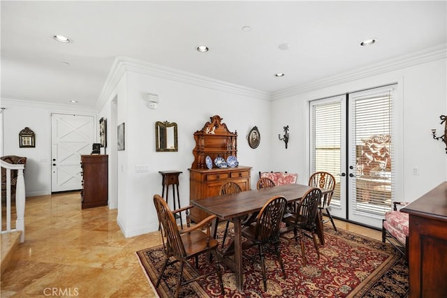 dining space featuring crown molding