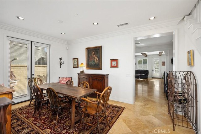 dining room with crown molding