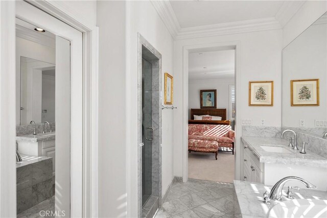 bathroom with vanity, crown molding, and separate shower and tub