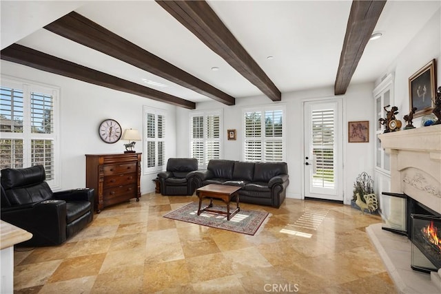 living room featuring beamed ceiling