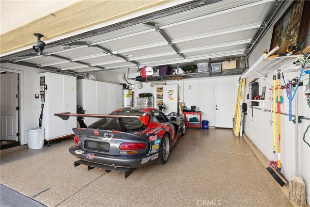 garage with strapped water heater