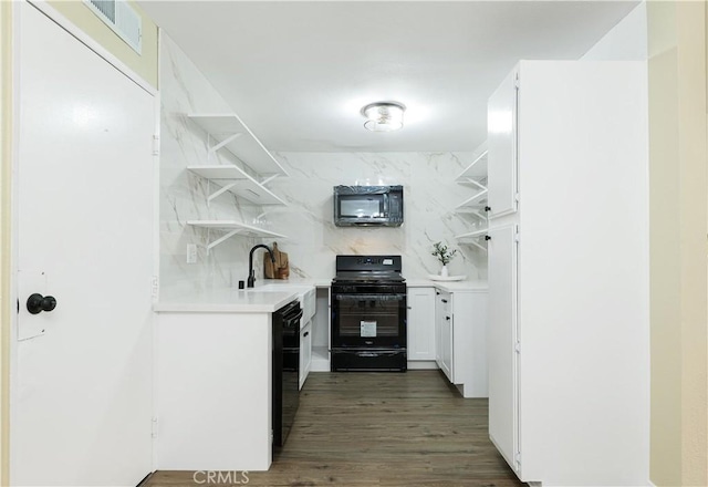 bar featuring black appliances, dark wood-type flooring, white cabinetry, decorative backsplash, and sink