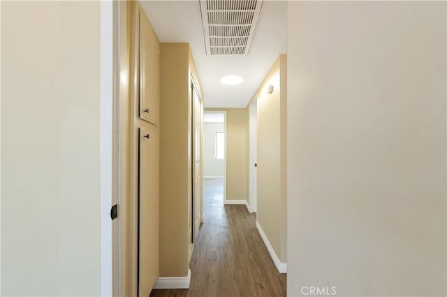 hallway featuring wood-type flooring