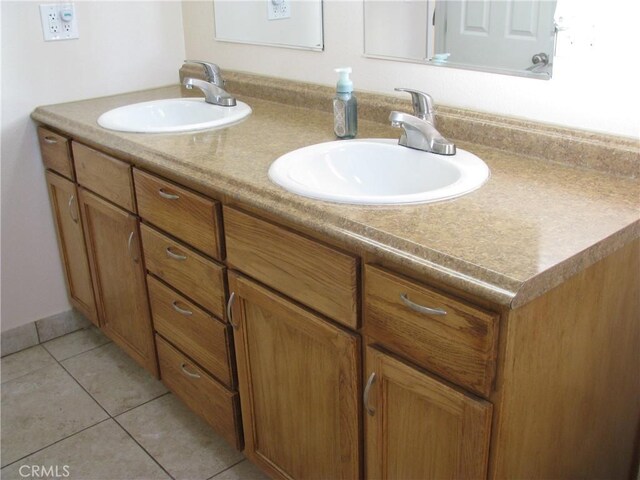 bathroom featuring tile patterned floors and vanity