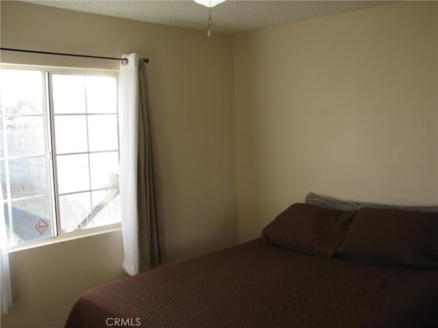 bedroom featuring a textured ceiling