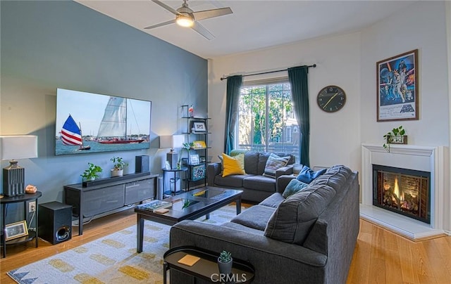 living room with ceiling fan and hardwood / wood-style flooring