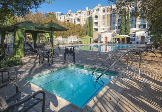 view of swimming pool featuring a patio