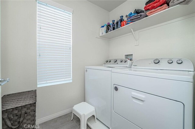 laundry room with washing machine and clothes dryer