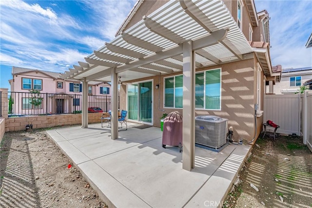 view of patio / terrace with central air condition unit and a pergola