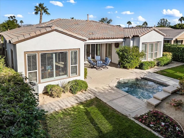 rear view of property with a patio