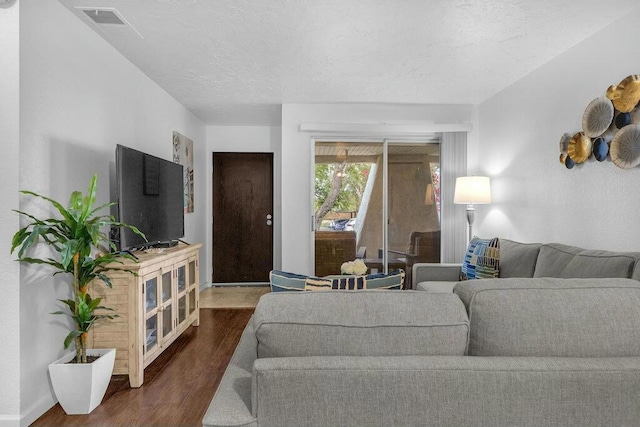 living room with dark hardwood / wood-style flooring