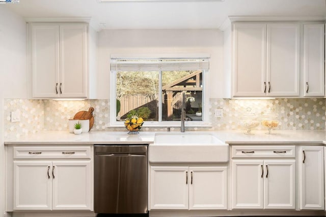 kitchen featuring white cabinetry, sink, and decorative backsplash