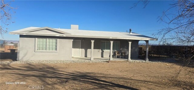 rear view of property with a patio area