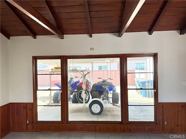 doorway featuring wood ceiling, wooden walls, and lofted ceiling with beams