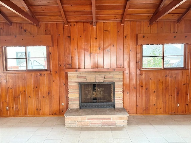 unfurnished living room featuring beam ceiling and wooden ceiling