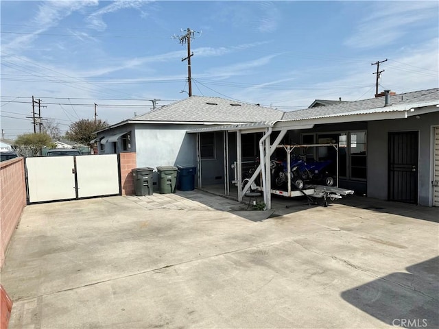 back of property featuring a patio