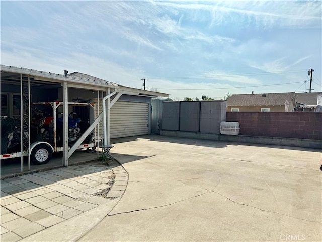 view of patio / terrace featuring a garage