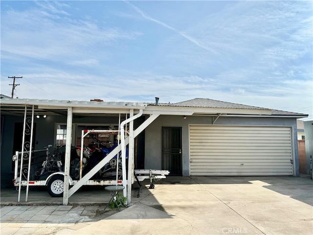 back of house with a garage