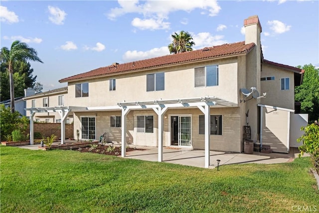 back of property with a yard, a patio, and a pergola