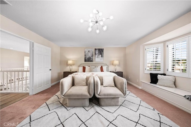 bedroom with light colored carpet and a chandelier